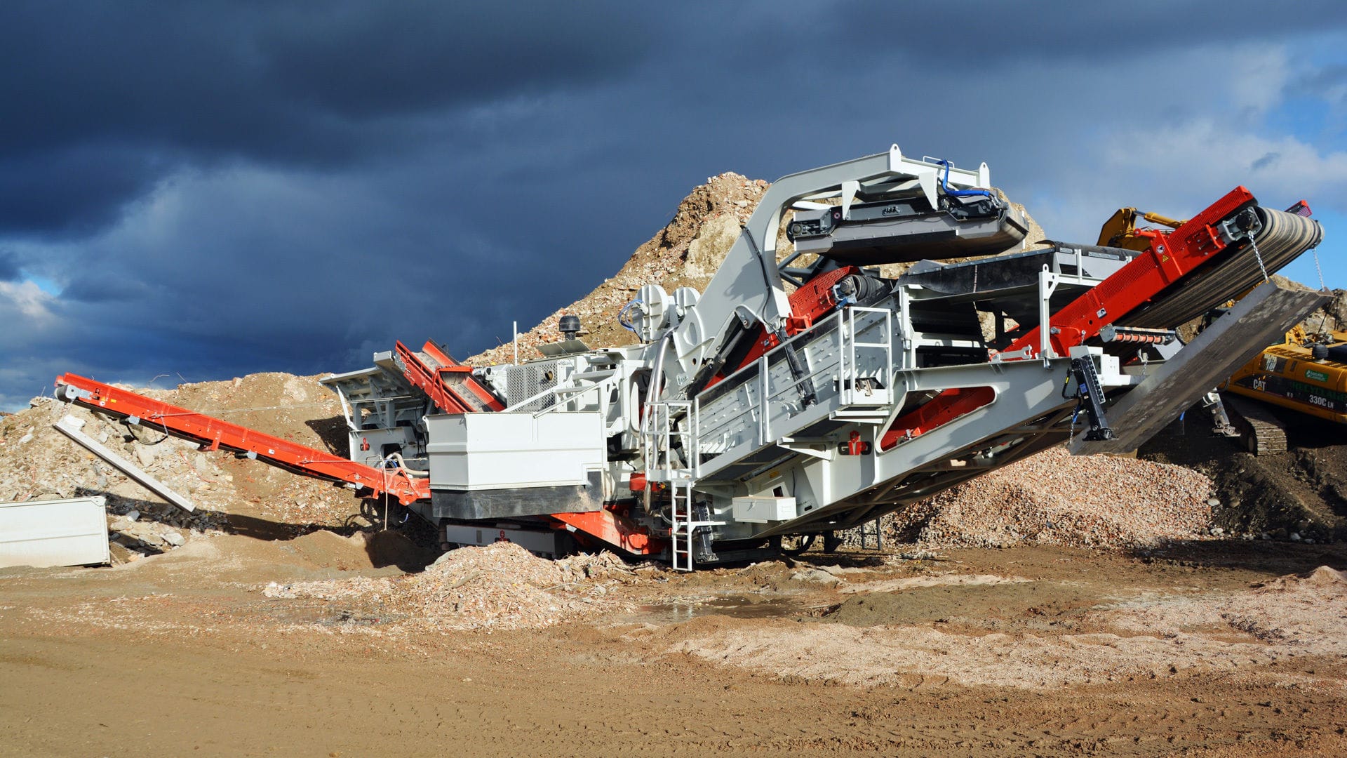 Crusher plant machinery processing M-Sand for Bangalore construction supply.